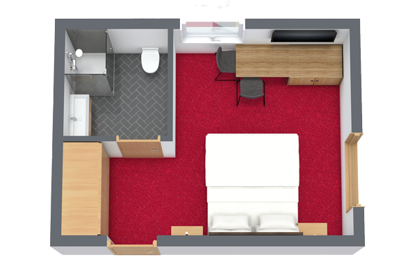 Draufsicht auf ein gemütliches Schlafzimmer, perfekt für Ihren „Urlaub zu Zweit in Serfaus-Fiss-Ladis“. Es verfügt über einen roten Teppich, ein bequemes Bett, einen Holzschreibtisch mit Stuhl, einen Kleiderschrank und ein eigenes Badezimmer. Ein Fenster über dem Schreibtisch lässt natürliches Licht in diesen charmanten Rückzugsort.